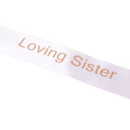 White ribbon with the words Loving Sister