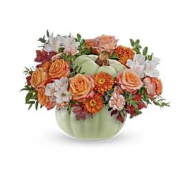 Pumpkin-shaped vase with orange and white flowers