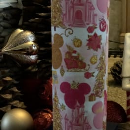 Holiday-themed cylindrical gift wrap with pink castle and Mickey silhouettes