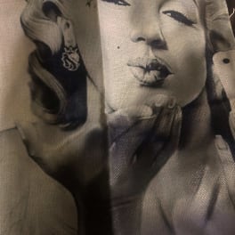 Printed fabric with a black-and-white portrait of a woman