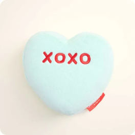 Light blue heart-shaped plush with red "xoxo" embroidery