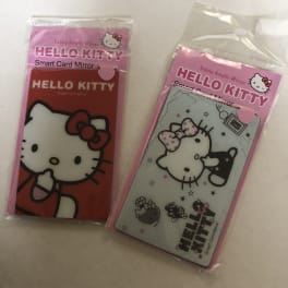 Two Hello Kitty smart card mirrors in plastic sleeves