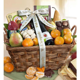 Fruit and chocolate gift basket with a sympathy ribbon