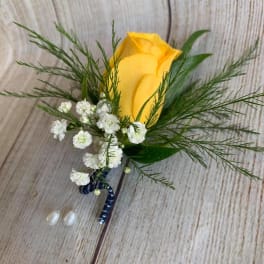 Yellow rose boutonniere with white baby's breath and greenery