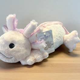 Plush pink-and-white axolotl toy with a product tag