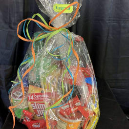 Cellophane-wrapped snack gift basket with colorful ribbon