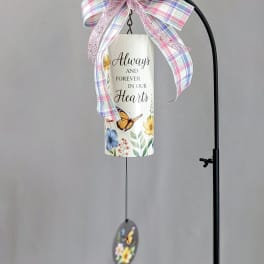 Decorative hanging memorial sign with a plaid bow and butterfly charm