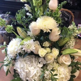 White floral bouquet with roses, lilies, and chrysanthemums