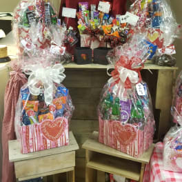 Gift baskets filled with assorted candy and wrapped in clear cellophane