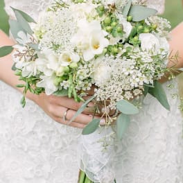 White bridal bouquet with eucalyptus and small white blooms