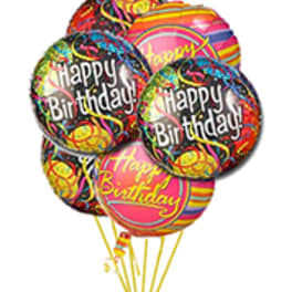 Cluster of colorful birthday balloons with printed messages