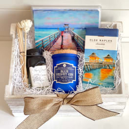 Gift basket with candles, chocolate, and decorative matches