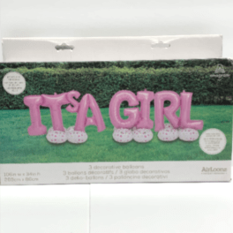 Boxed set of pink 'It's a Girl' letter balloons with white polka-dot bases on a grassy background