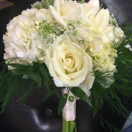 White rose and hydrangea bouquet with greenery