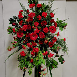 Large red floral standing spray on an easel