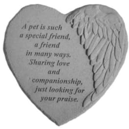 Heart-shaped stone plaque with engraved angel wing and memorial text