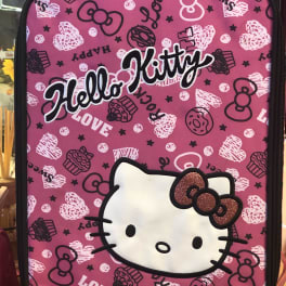 Pink Hello Kitty backpack with a black zipper and patterned front