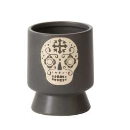 Black ceramic candle holder with a skull design