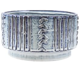 Blue and white ceramic planter with vertical ridges