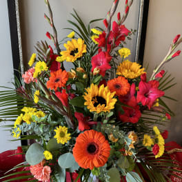 Bright mixed bouquet with sunflowers, gerbera daisies, and red gladiolus