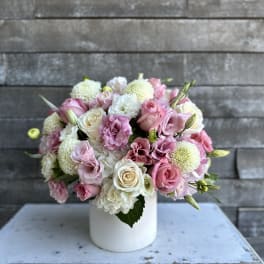 Pink and white bouquet in a white vase