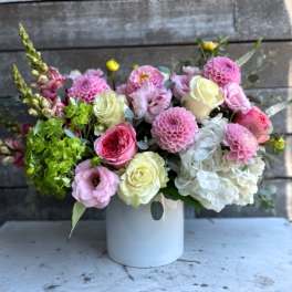 Pink and white mixed bouquet in a white vase