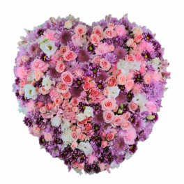 Heart-shaped bouquet of pink, purple, and white flowers
