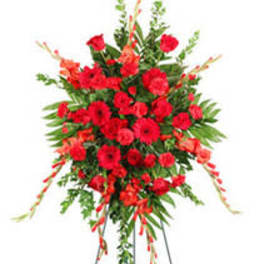 Large red floral standing spray on an easel