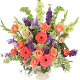 Colorful mixed flower arrangement in a white vase