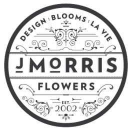 Circular logo reading J Morris Flowers with decorative flourishes