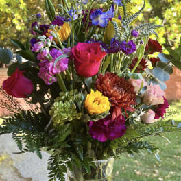Colorful mixed bouquet in a clear glass vase
