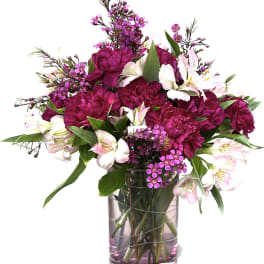 Pink and white bouquet in a clear glass vase
