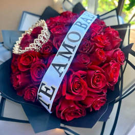 Bouquet of red roses with a tiara and a "MOM" sash