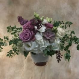 Bouquet of purple and white flowers in a vase