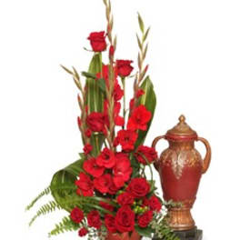 Tall red rose arrangement with a decorative urn