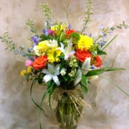 Colorful mixed flower bouquet in a glass vase