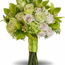 Bouquet of pale green and white roses with orchids