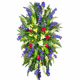 Tall standing floral spray with blue, white, and red flowers