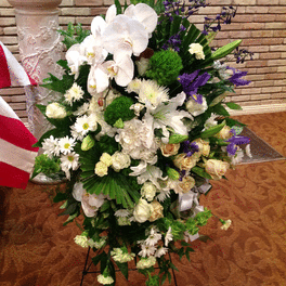 Tall white and purple floral spray with orchids and lilies