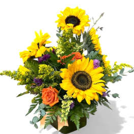 Bouquet of sunflowers and orange roses in a vase