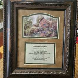 Framed memorial plaque with a countryside scene and poem
