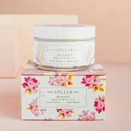 Jar of body butter on a floral-patterned box