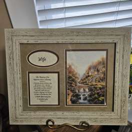 Framed memorial display with a landscape print and the word Wife