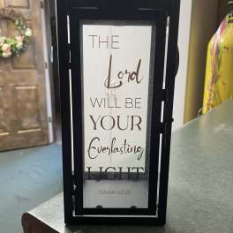 Black lantern with a Bible verse sign inside