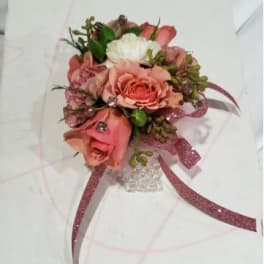 Pink and white rose boutonniere with glitter ribbon