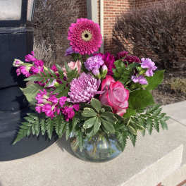 Pink and purple bouquet in a glass vase