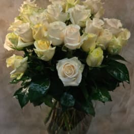 Bouquet of white roses in a glass vase