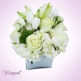 White floral arrangement in a light blue vase