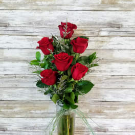 Bouquet of red roses in a glass vase