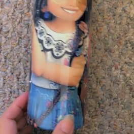 A printed tumbler with a cartoon girl design
